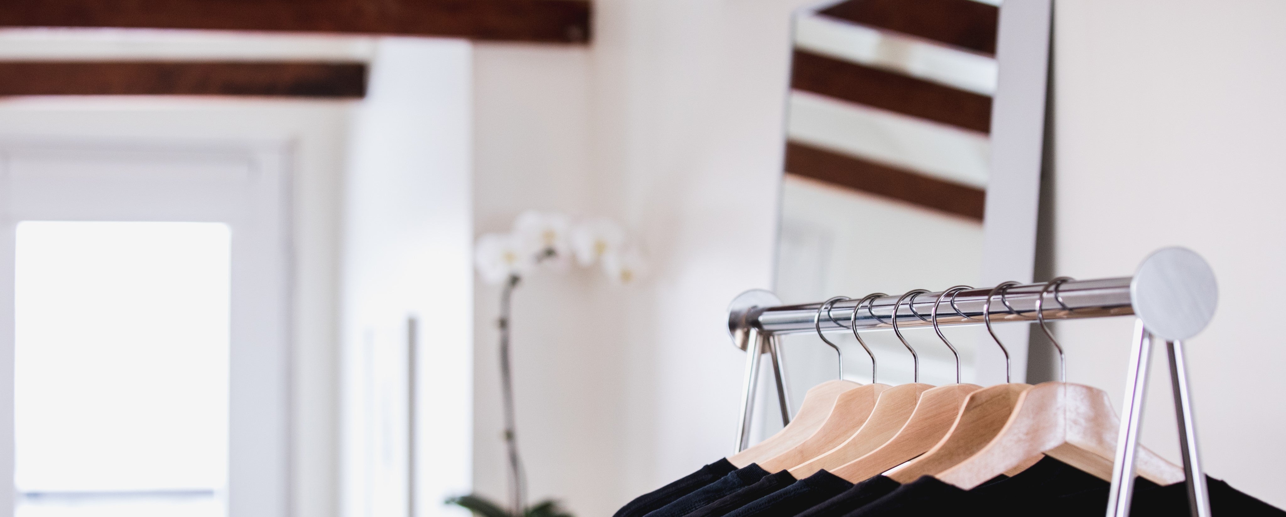clothing-on-a-shop-rack-with-flowers-in-the-background_cropped.jpg